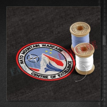 Emblema NATO Mountain Warfare Centre of Excellence